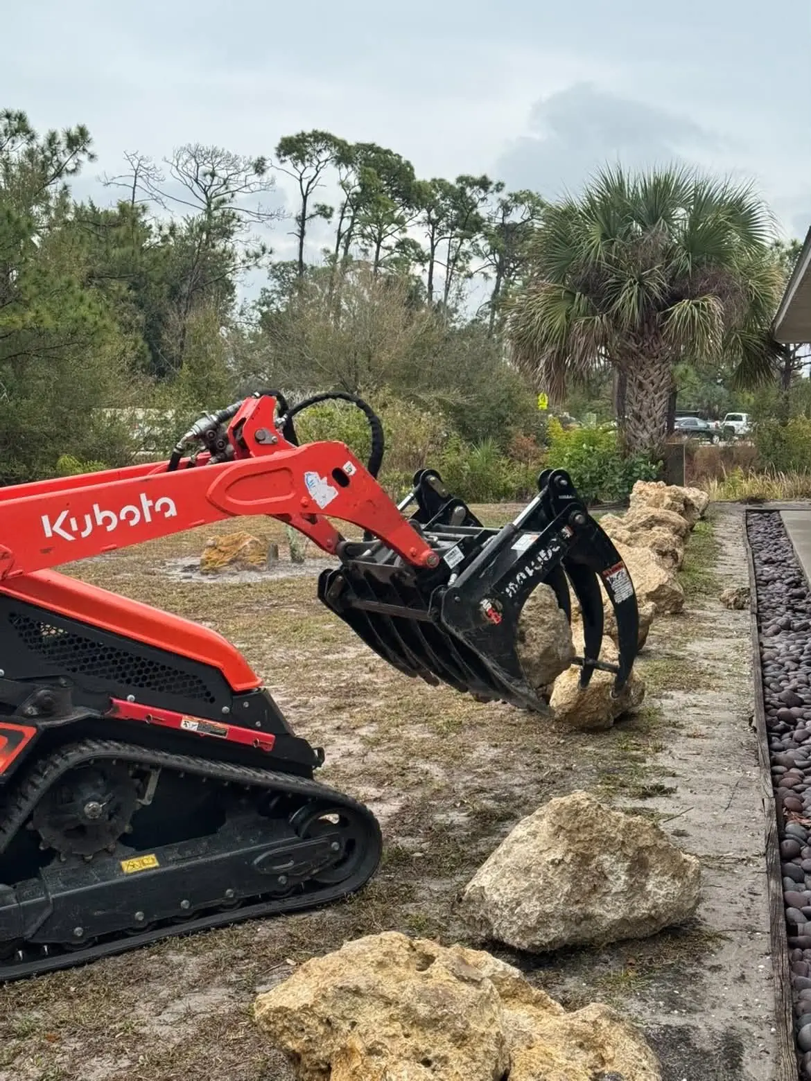 Setting limestone boulders